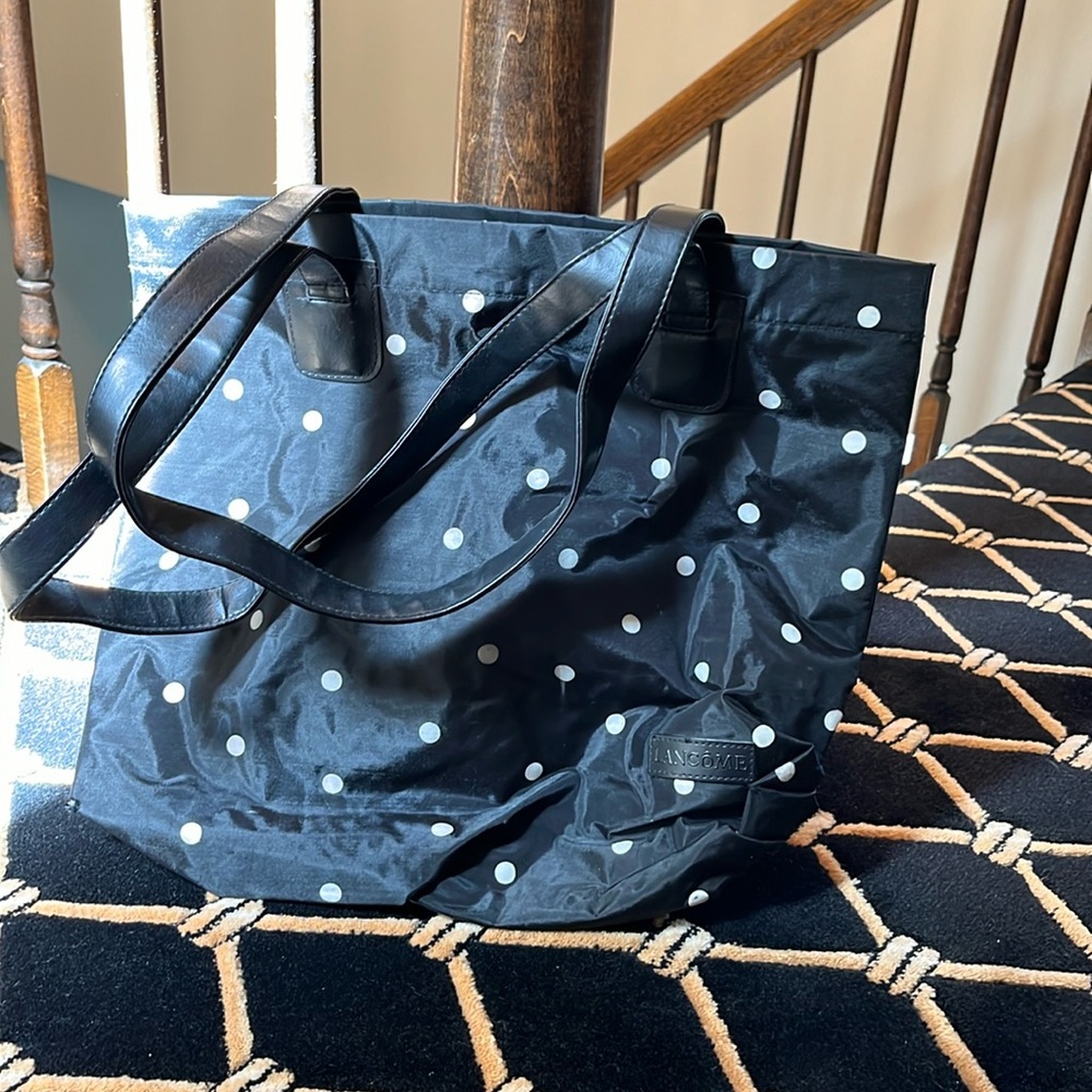 Lancôme versatile carry bag with snap and zipper compartments